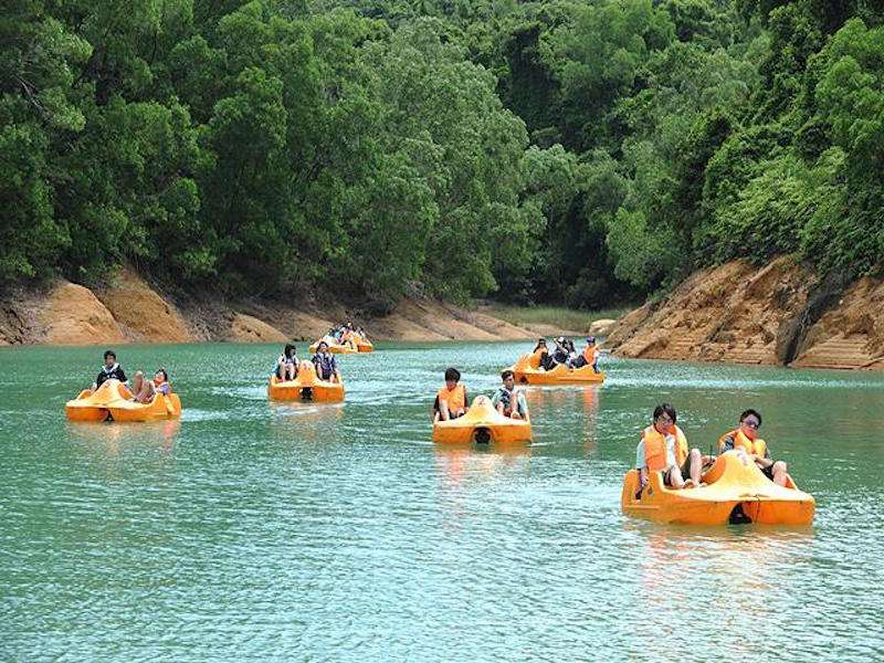 People riding pedal boats in a lake Outdoor activities kids macau