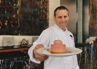 chef sebastien bernie holding pink bloom cake mandarin oriental macau